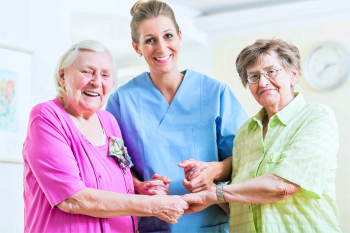 caregiver and two senior women